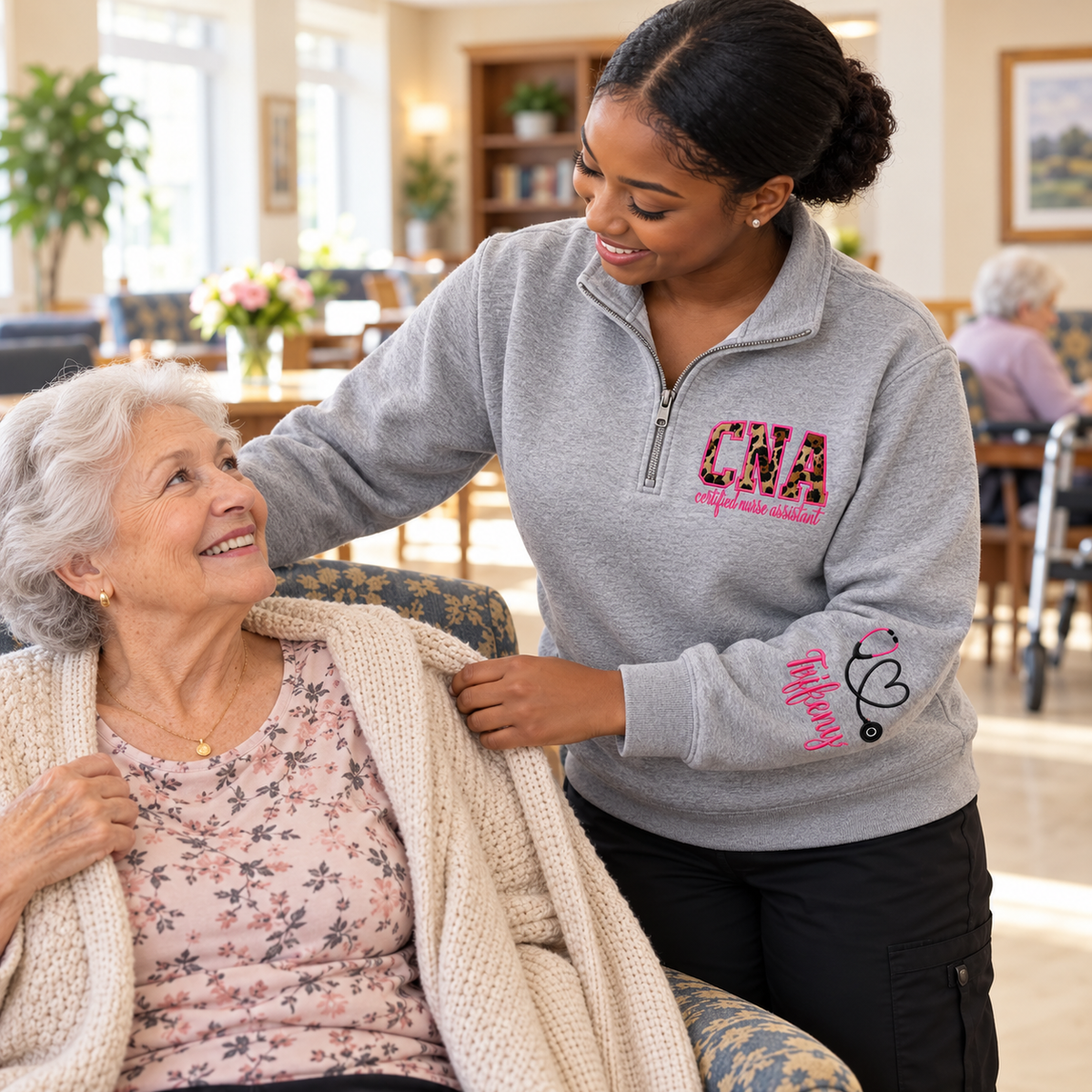 CNA quarter zip worn while helping a nursing home resident
