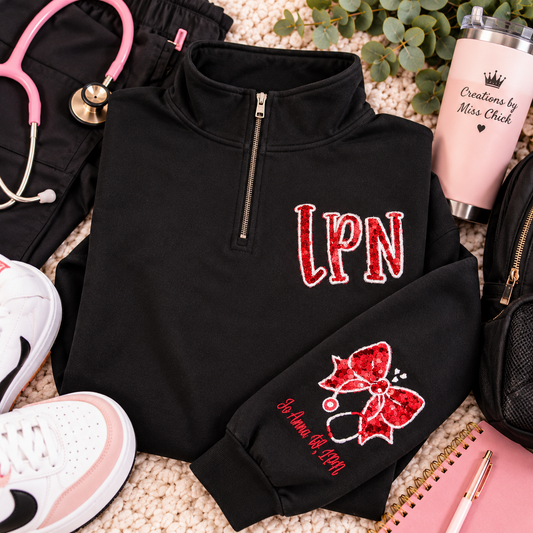 LPN black quarter zip red sequin appliqué boutique flat lay